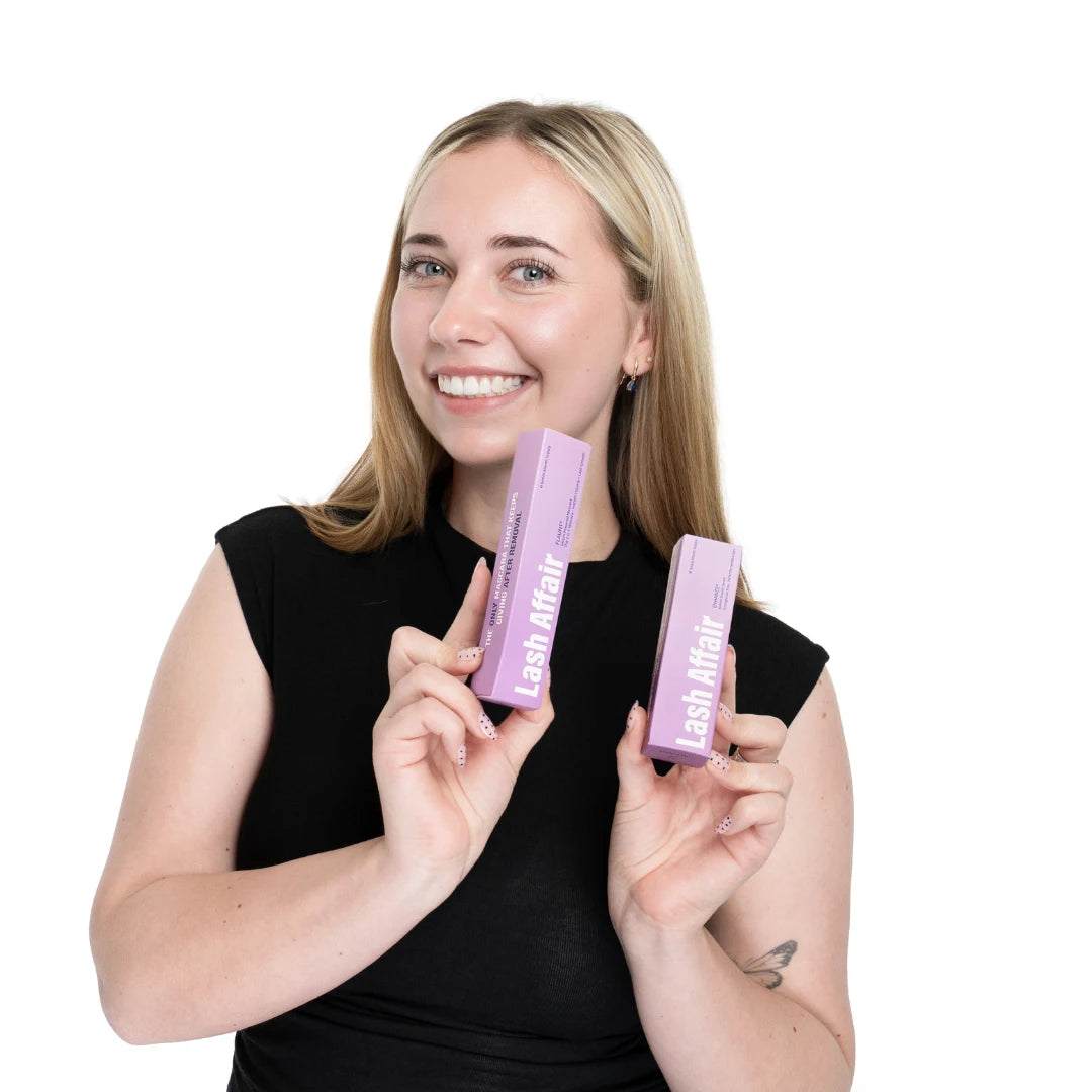 woman holding mascara growth serum and eyelash growth serum