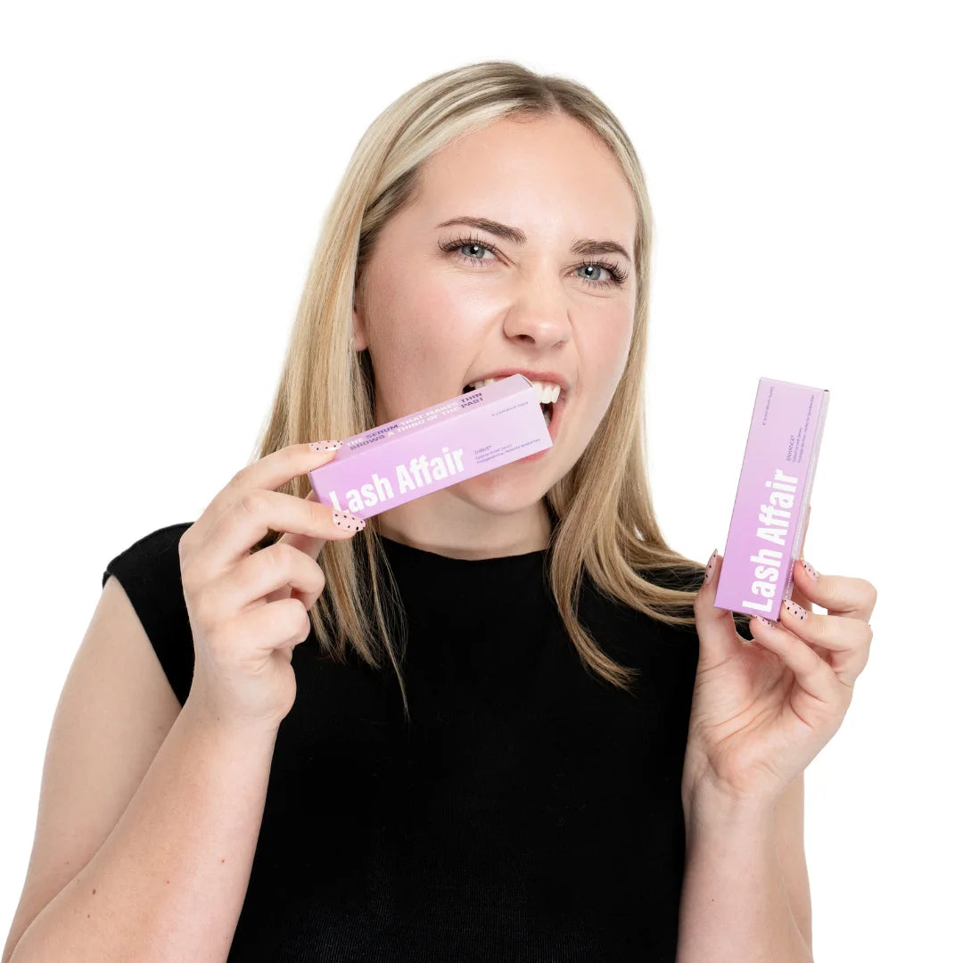 woman holding a eyebrow growth serum and a eyelash growth serum